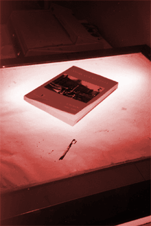 one of our trusty light tables with an AU course booklet